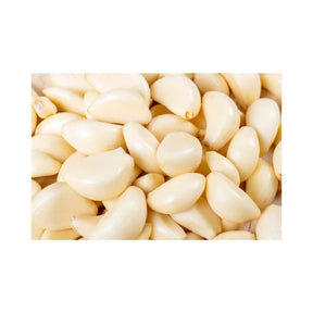 Peeled large Chinese garlic on a white background