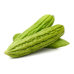 Organic Chinese bitter melon, fresh green ridged gourds, 500g pack isolated on white background