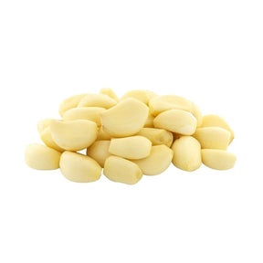 Fresh peeled Chinese garlic cloves on a white background