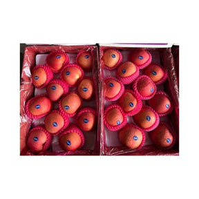 Fresh Fuji apples, sweet crisp apples packed per box isolated on white background