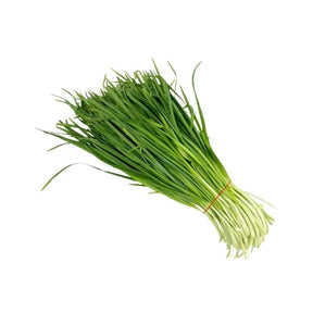 Fresh green chive leaves on a white background