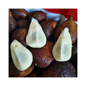 Fresh Indonesian salak fruit, whole snake fruit packed per box isolated on white background