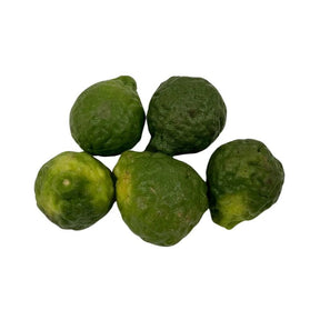 Fresh kaffir limes on a white background