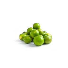 Fresh large limes, aromatic Thai limes sold per kg isolated on white background