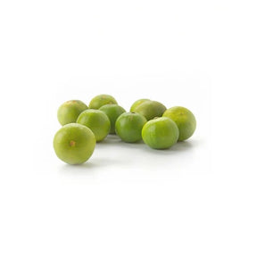 Fresh small limes, aromatic Thai limes sold per kg isolated on white background