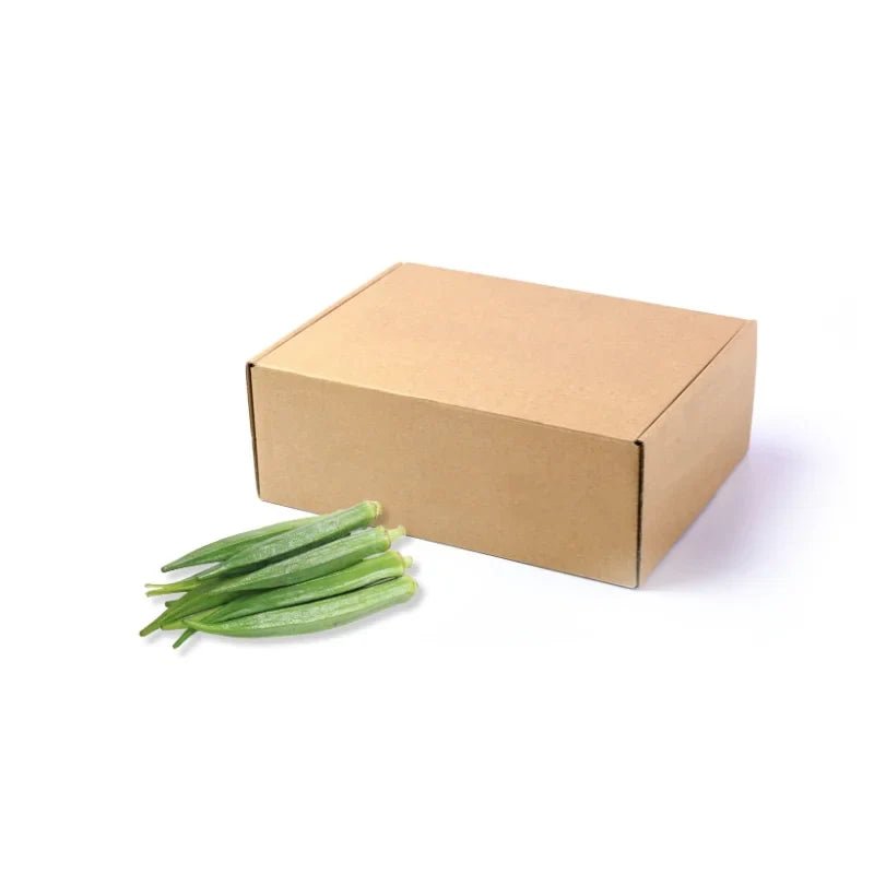 Fresh okra pods, tender green lady fingers, 5kg bulk pack isolated on white background