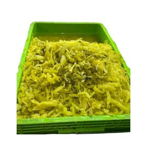 Pickled mustard greens chopped on a white background